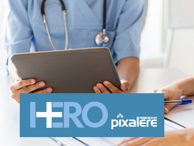 Photo of HERO logo and nurse holding tablet